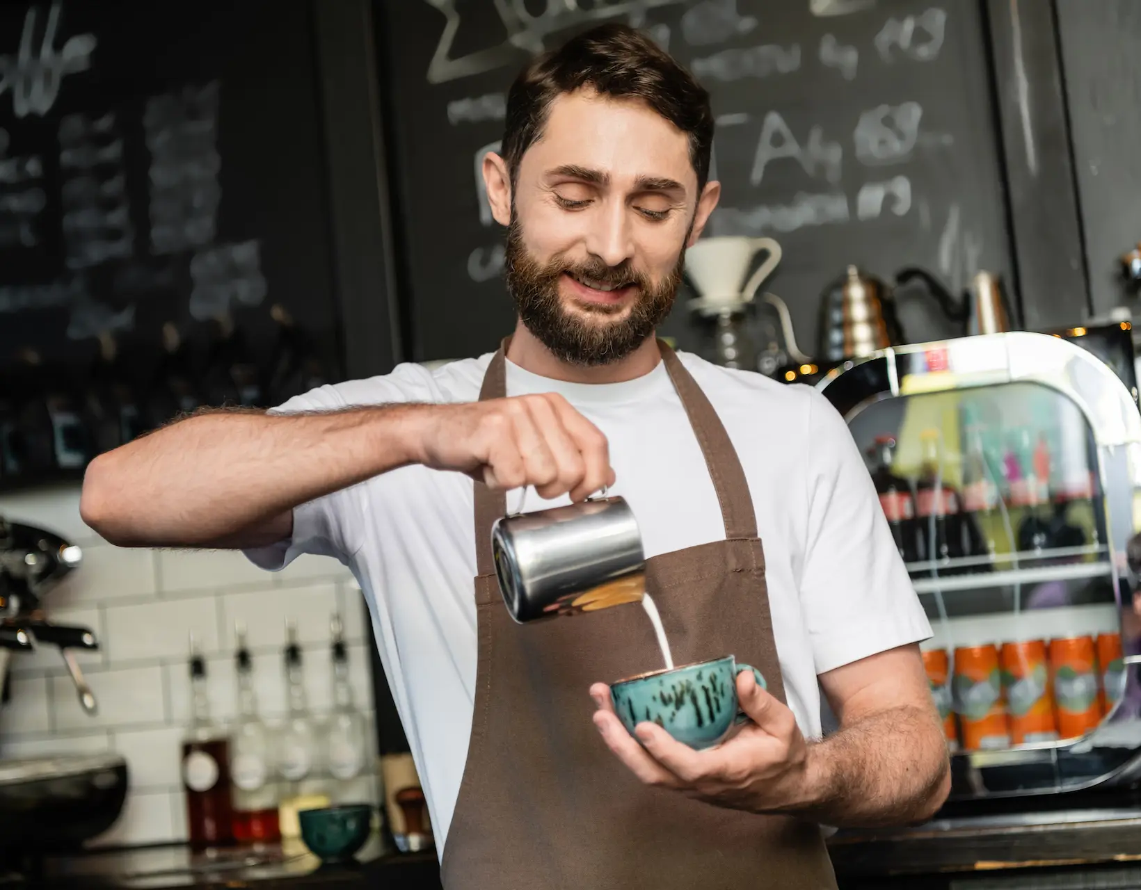 positive barista in apron pouring milk from pitche 2024 11 13 13 19 09 utc 1